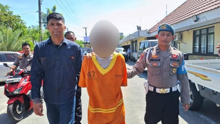 Tersangka HD (57) diamankan kepolisian (FOTO: PB)