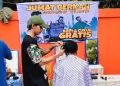 Jumat Berkah Madsarah Jalanan adakan kegiatan Cukur Rambut Gratis di dekat Islamic Center. (Dok. Tangkapan Layar]